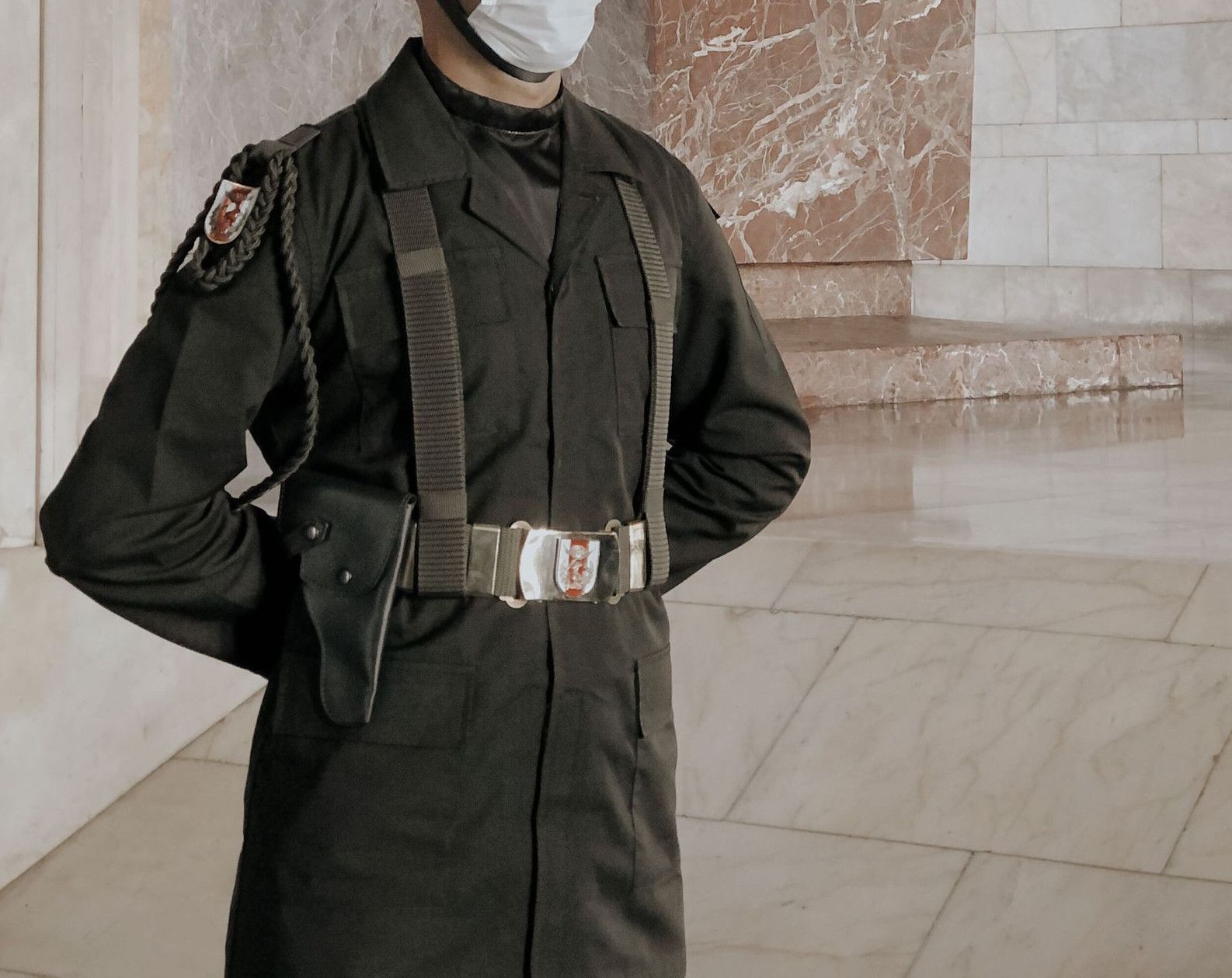 A soldier standing guard at Anıtkabir, Ankara, in uniform and mask.